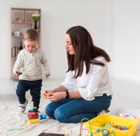side view mom playing with child home 23 2148463662 mad